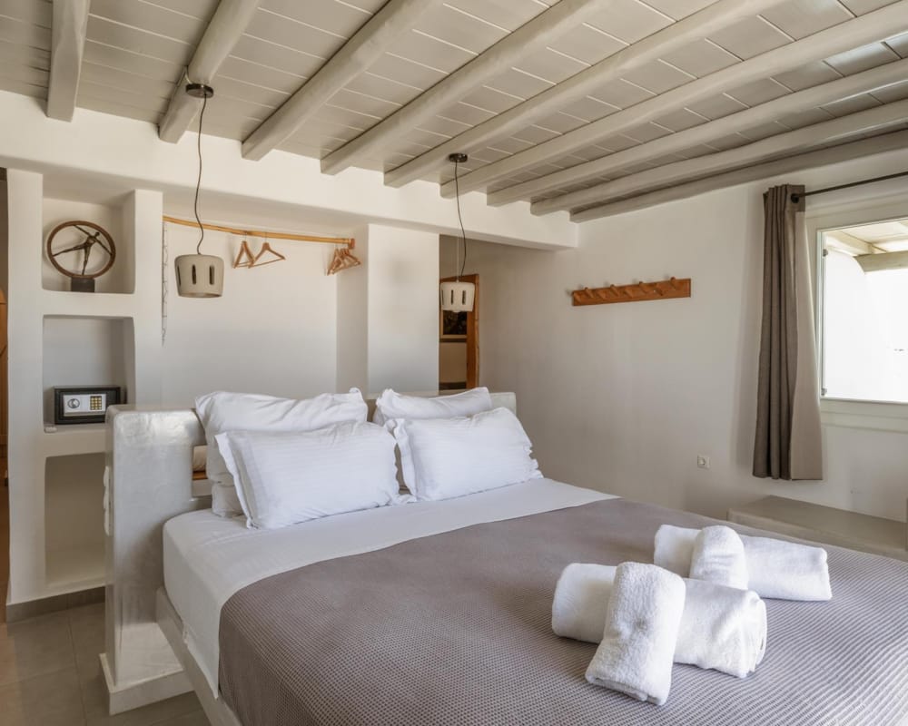 a bed with white sheets