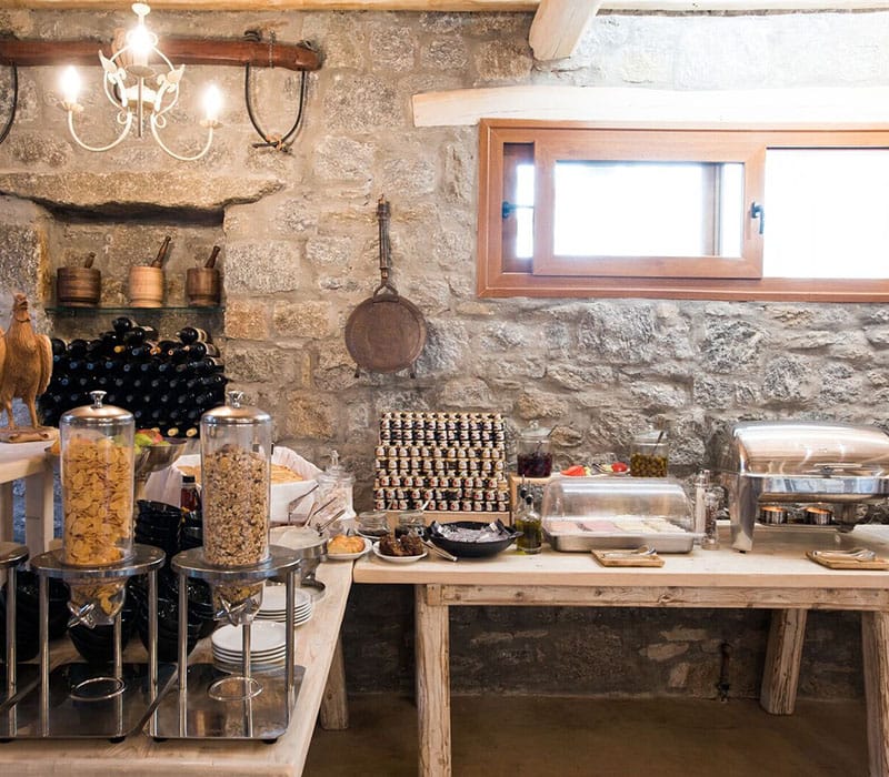 a kitchen with a stone wall