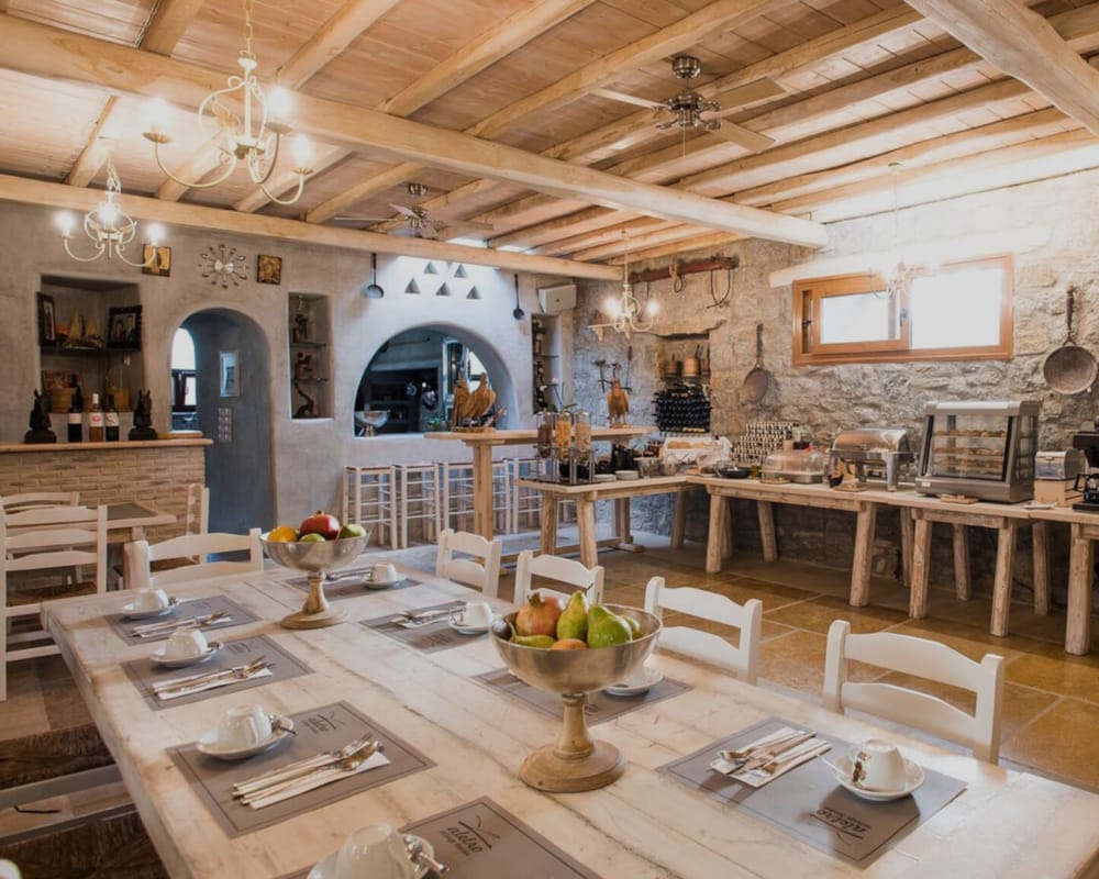 a large kitchen with a stone wall