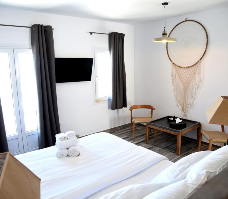 a bedroom with a bed and a table