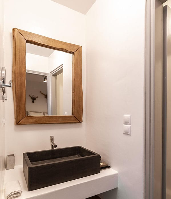 a bathroom with a mirror and sink
