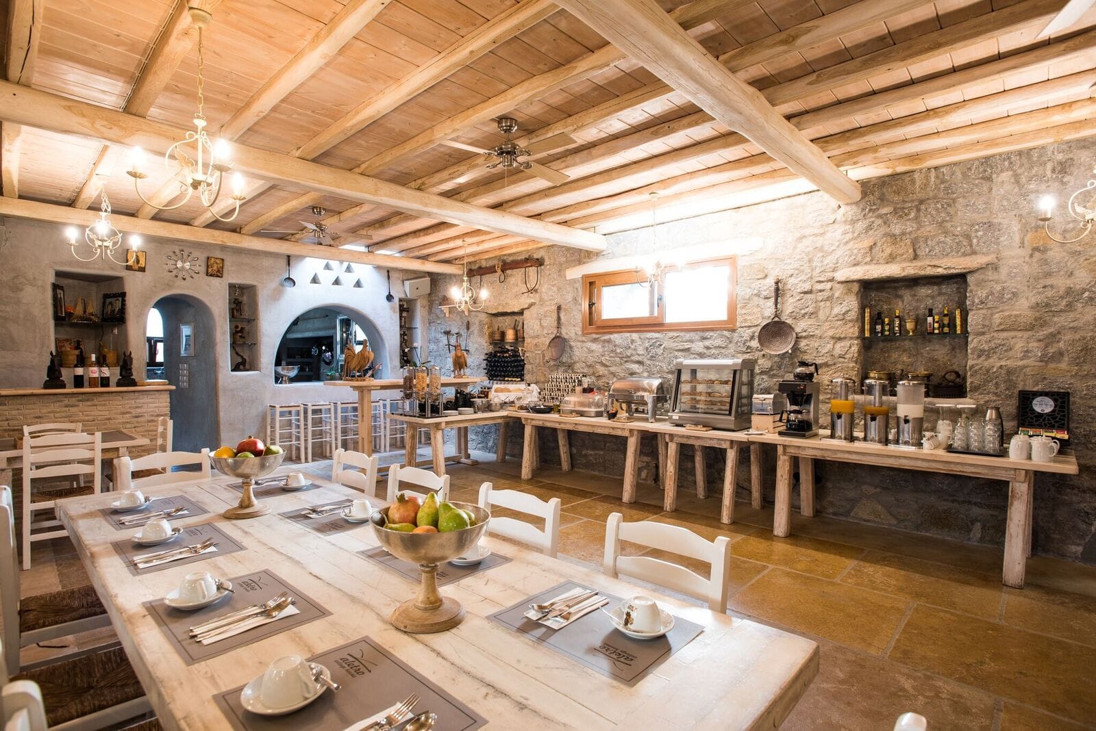a large kitchen with a large stone ceiling