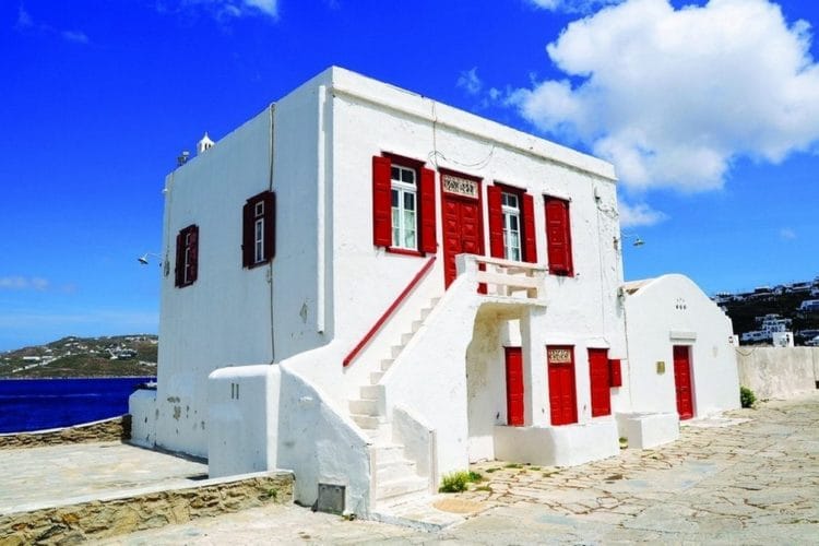 a white building with red doors