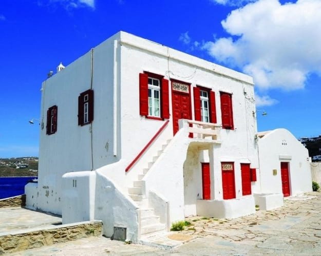 a white building with red doors