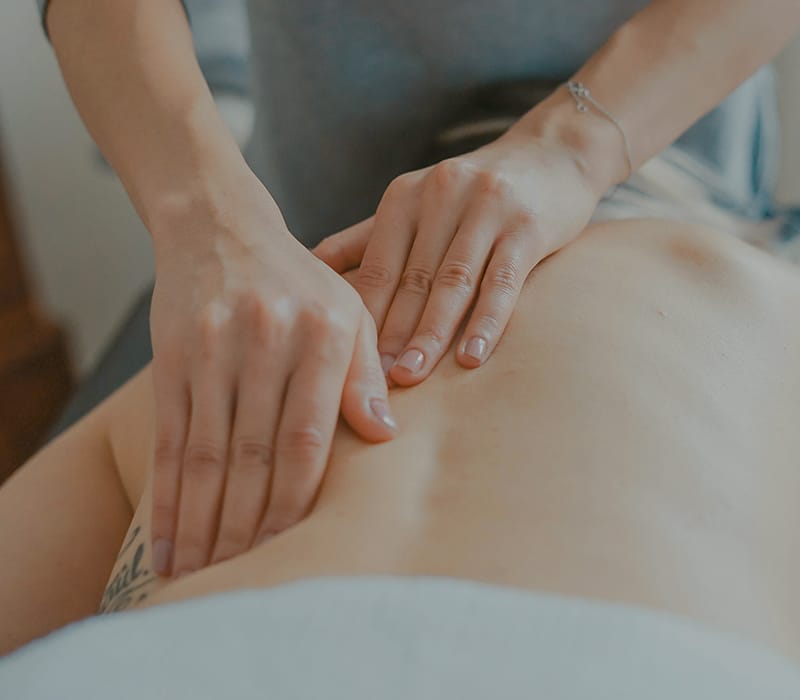 close-up of hands on a woman's belly