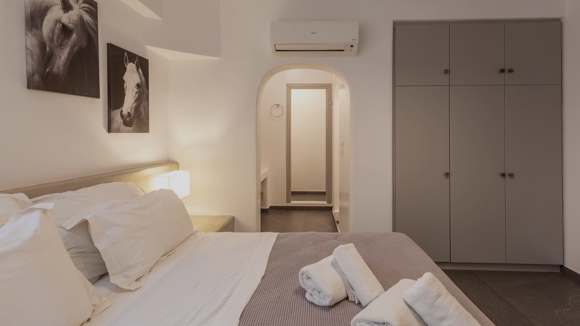 a room with white beds