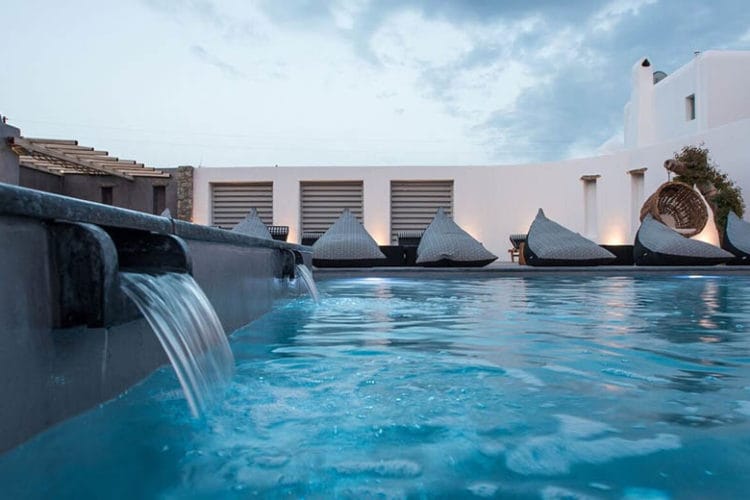 a pool with a building in the background