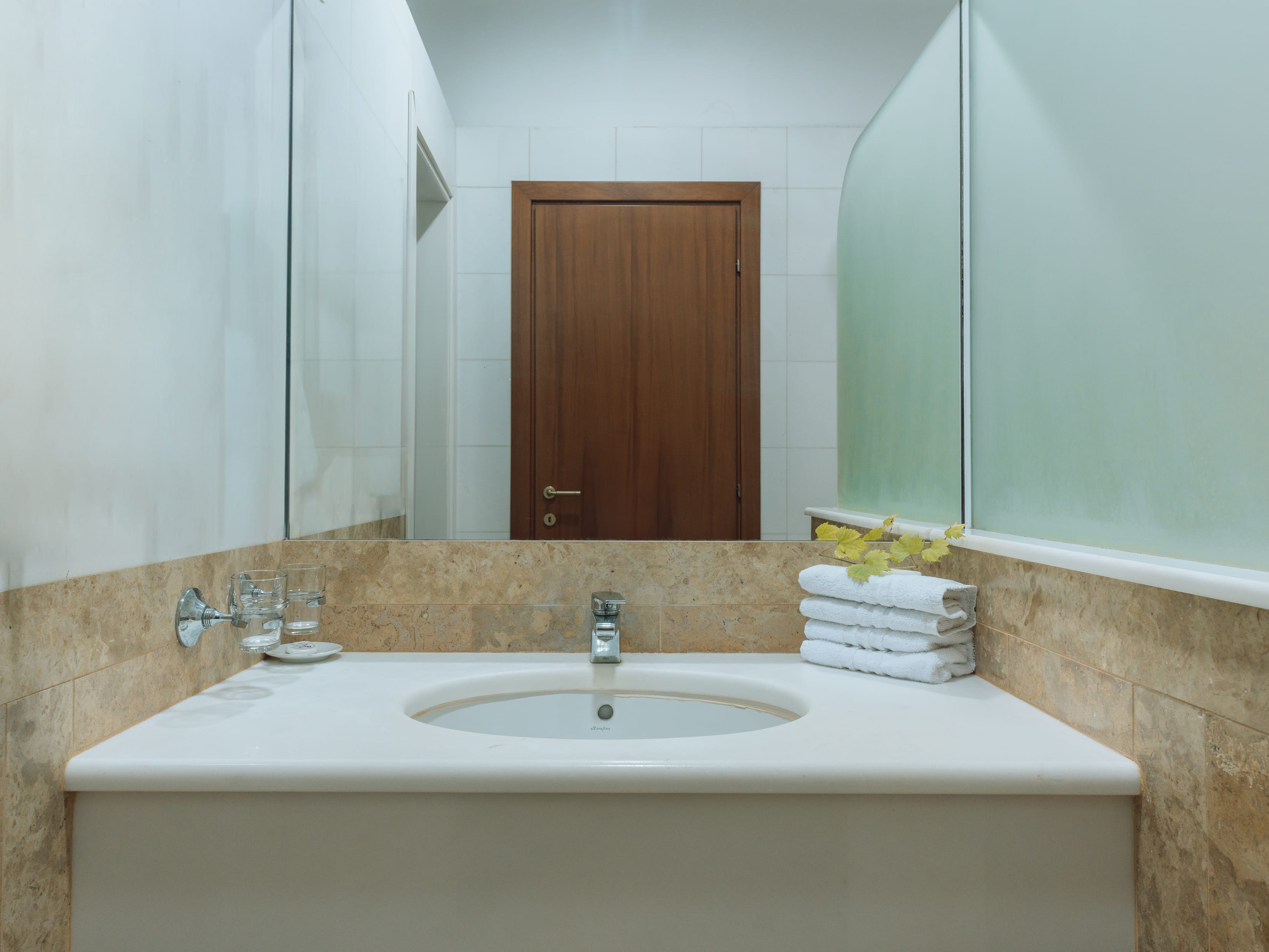 a bathroom with a large mirror