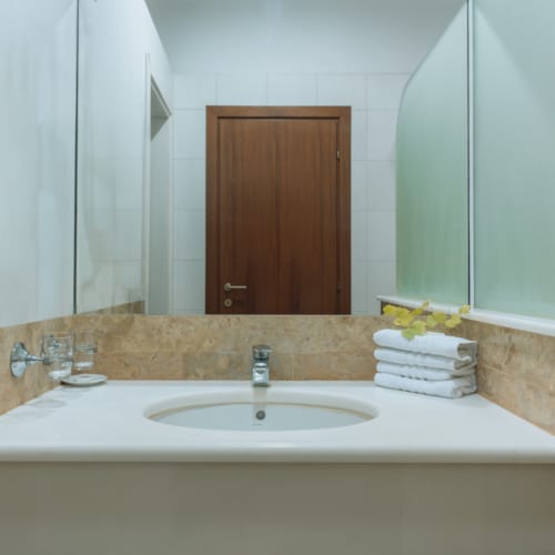 a bathroom with a large mirror