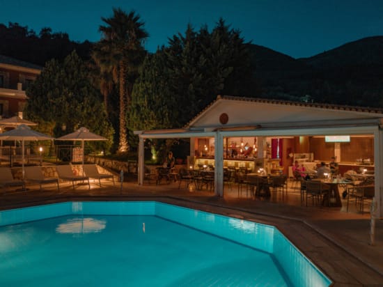 a pool with a building in the background