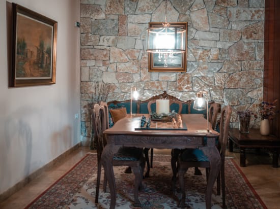 a dining table with candles on it