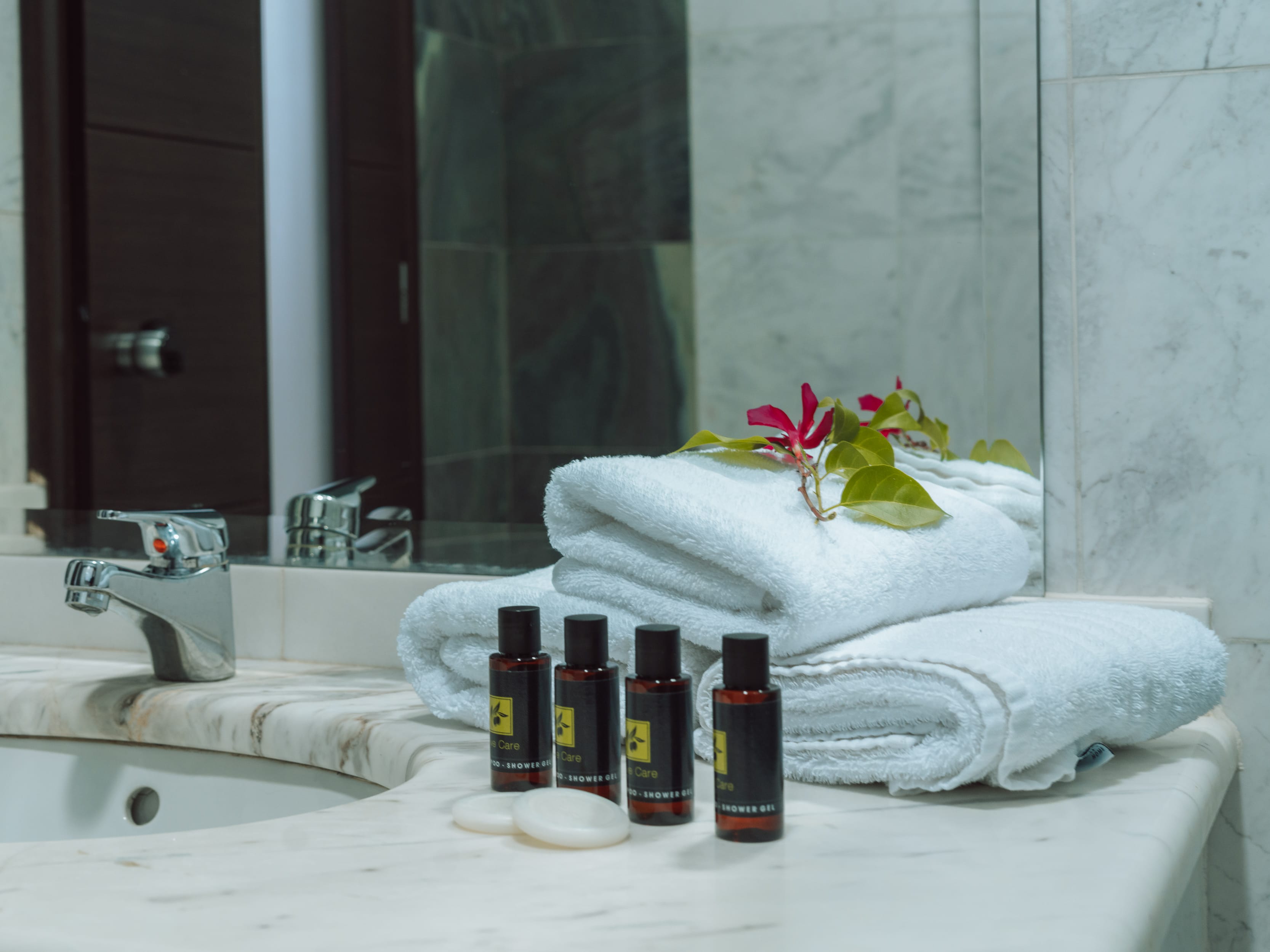 a bathroom with a flower arrangement