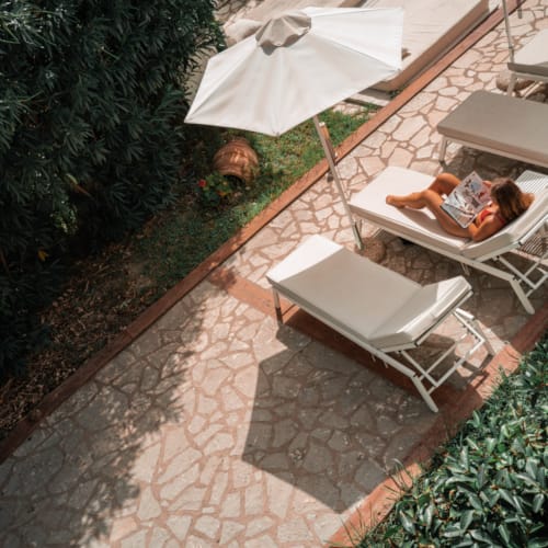 a patio with a table and chairs