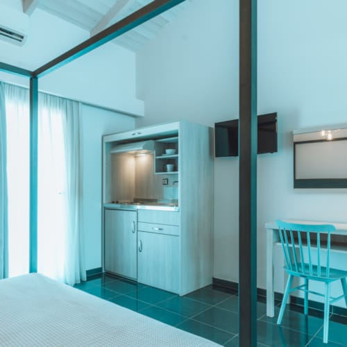 a kitchen with a table and chairs