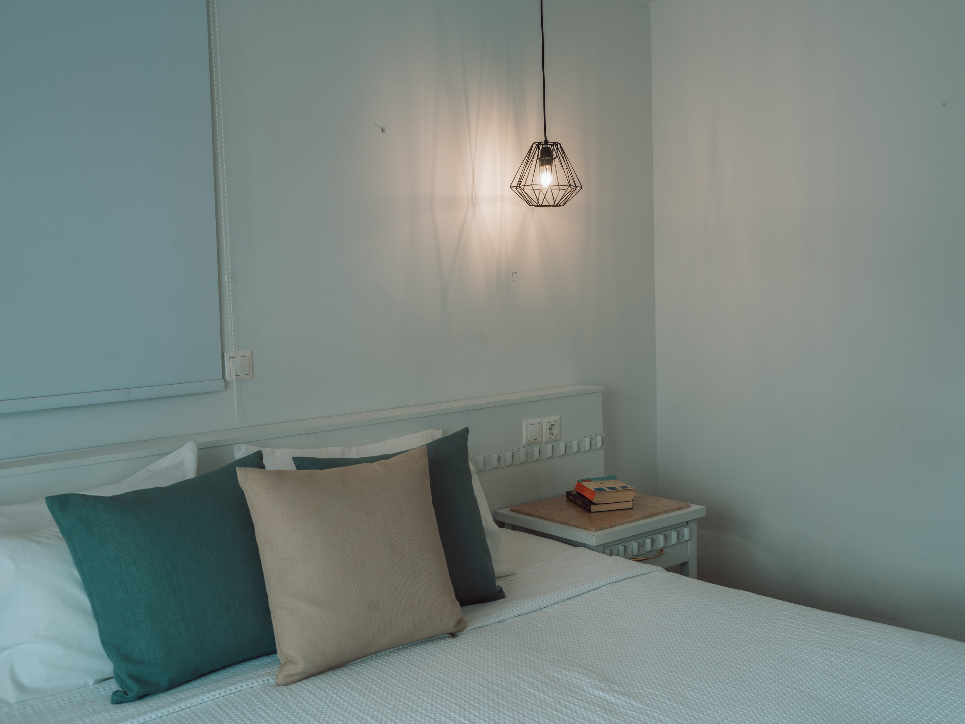 a bed with a lamp on it