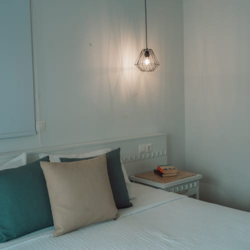 a bed with a lamp on it