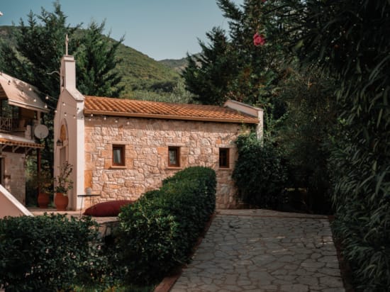 a stone building with a stone walkway