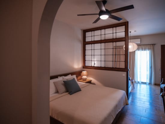 a bedroom with a large mirror