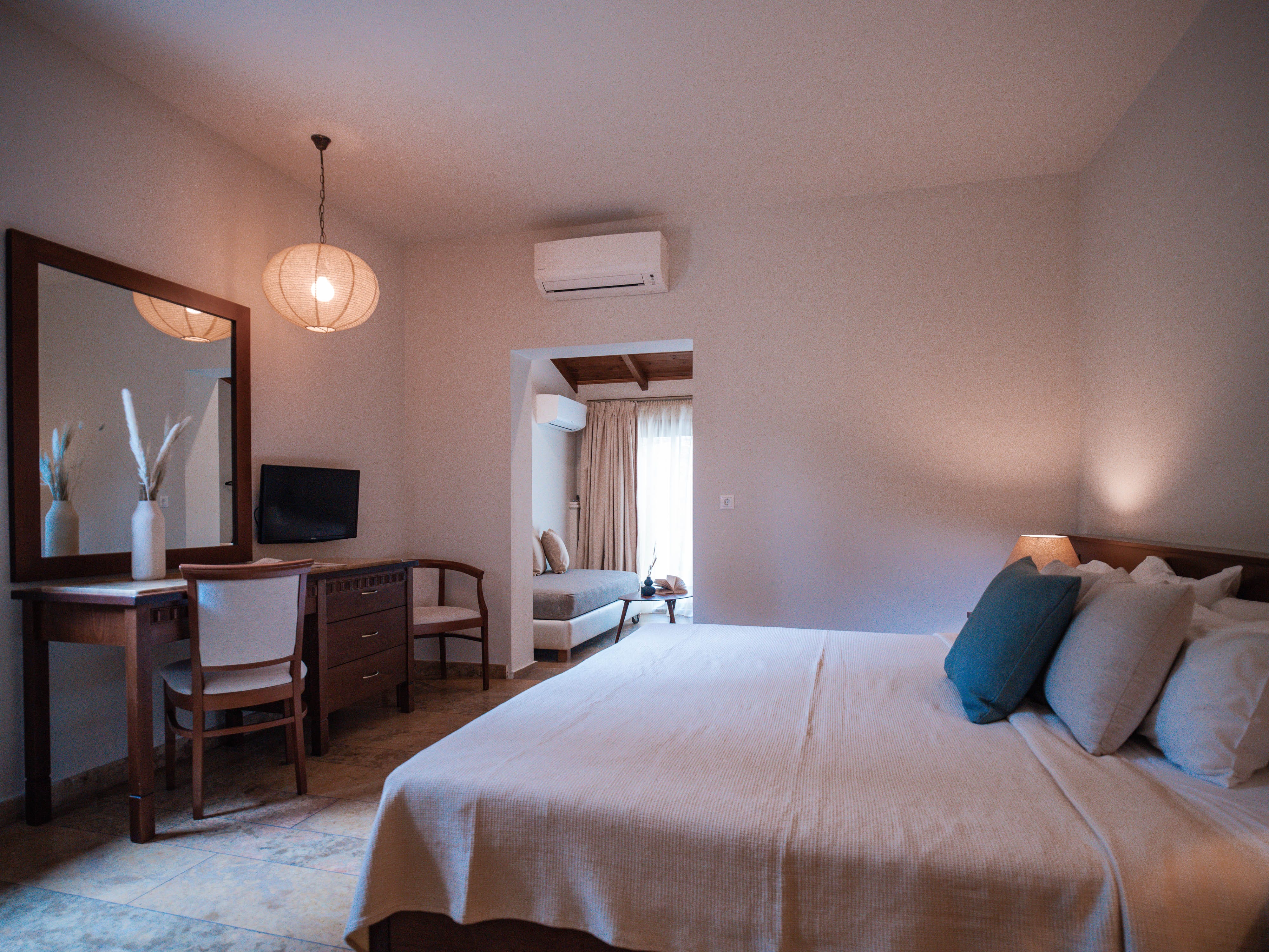 a bedroom with a bed and desk