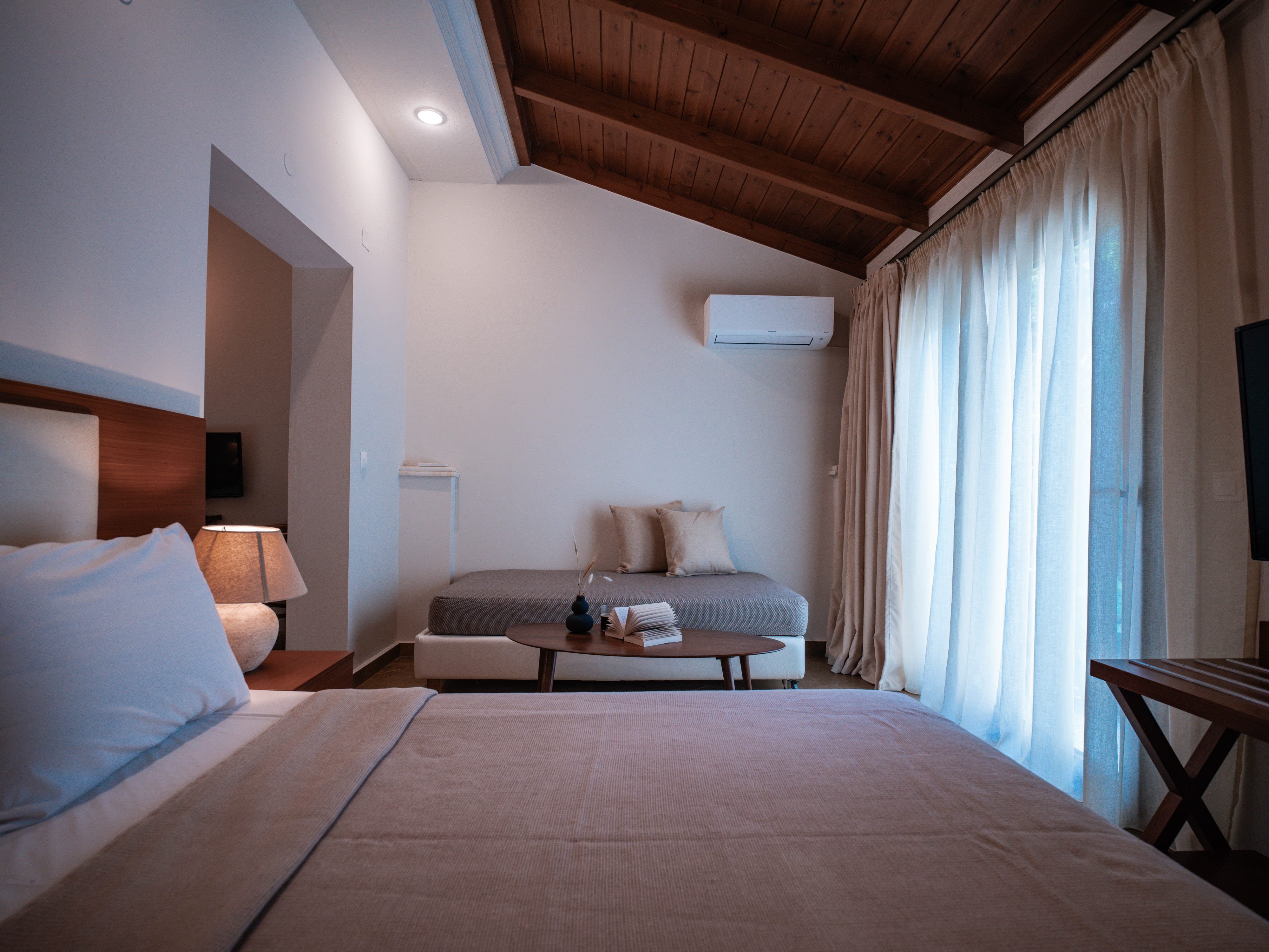 a bedroom with a bed and a table