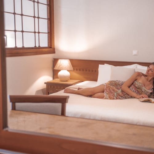 a person laying on a bed