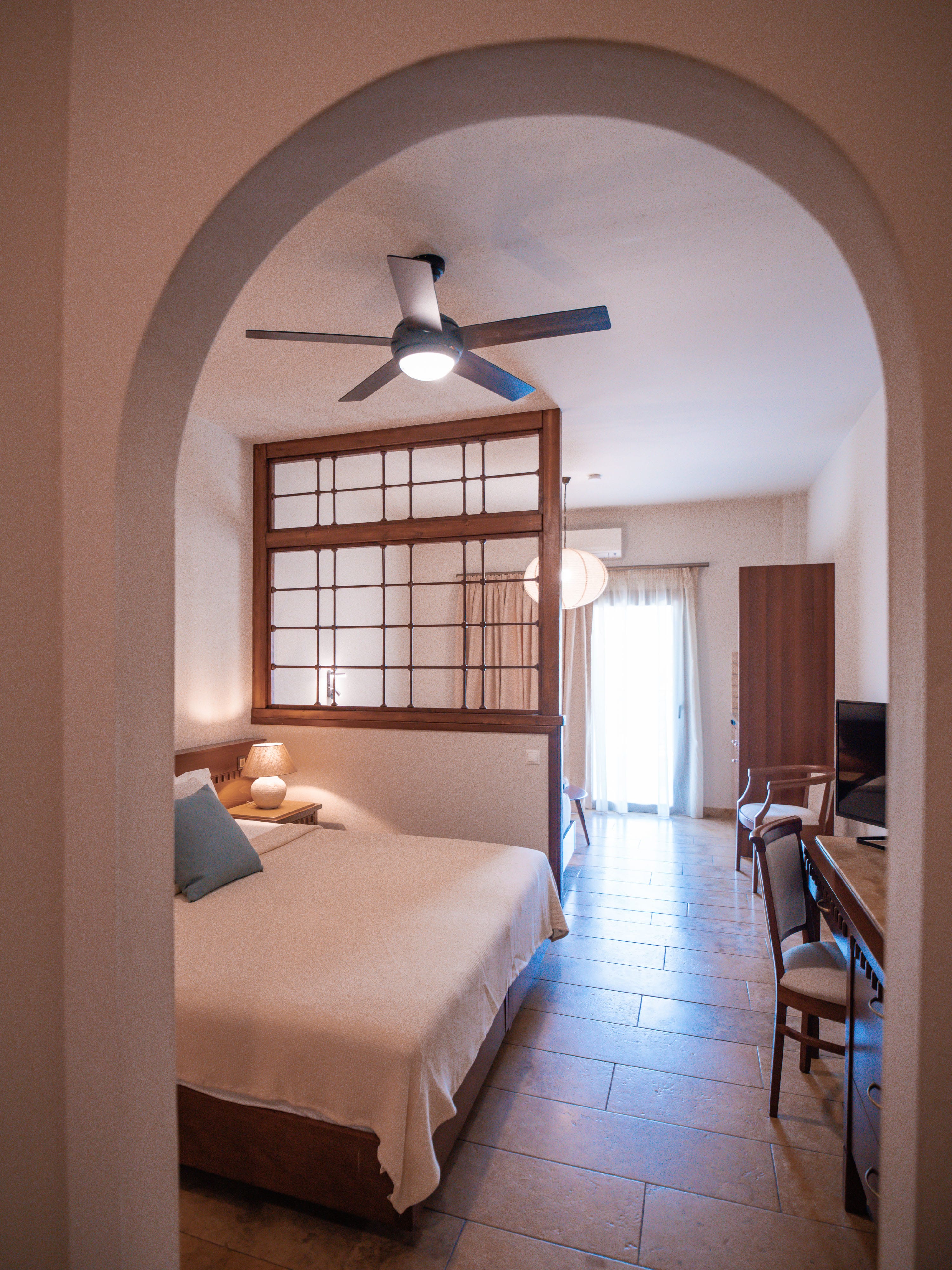 a bedroom with a large window