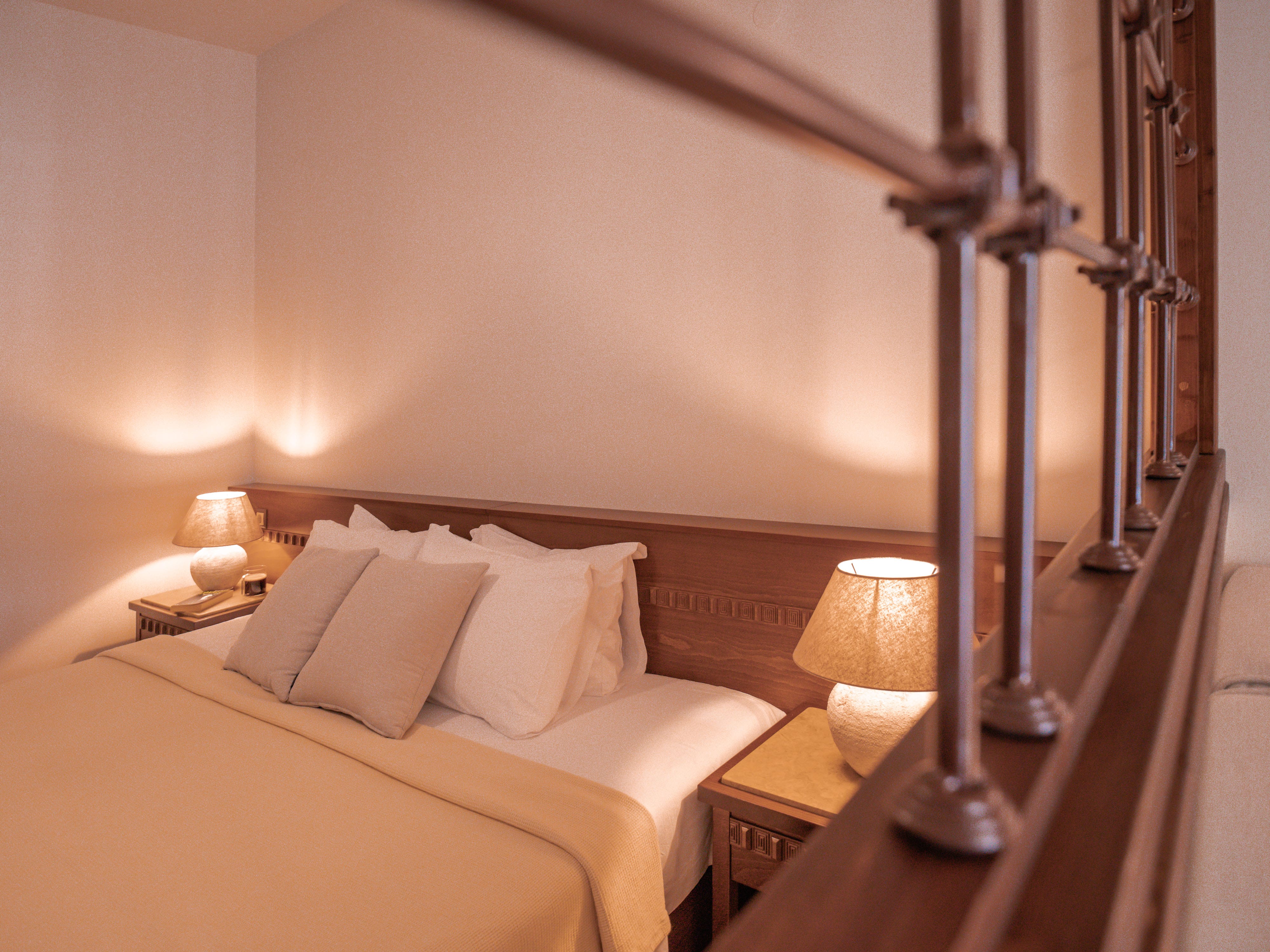 a bed with a lamp on the side