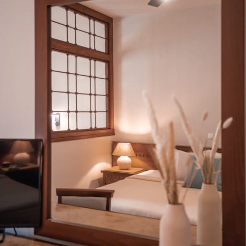 a room with a bed and a window