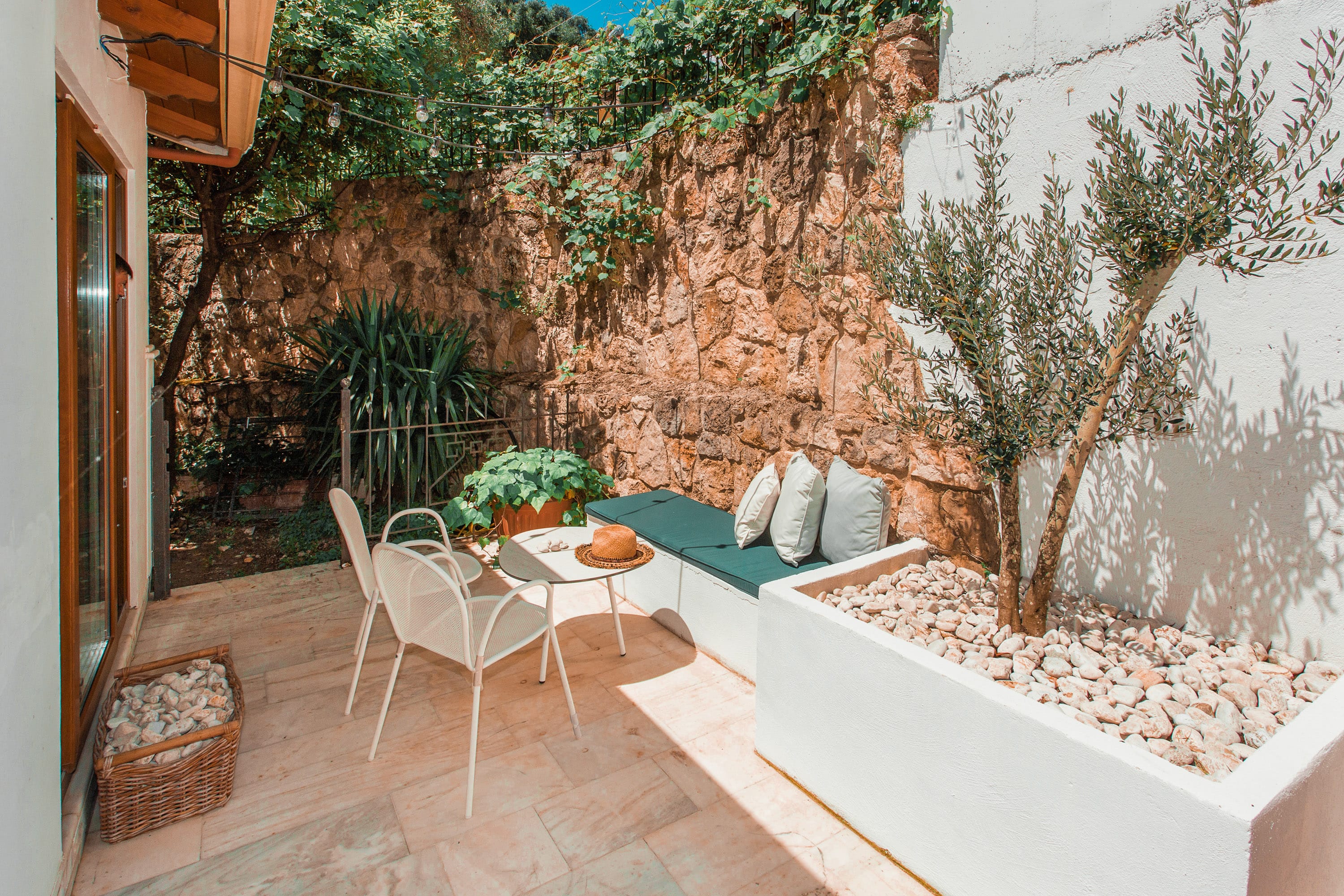 a patio with a table and chairs