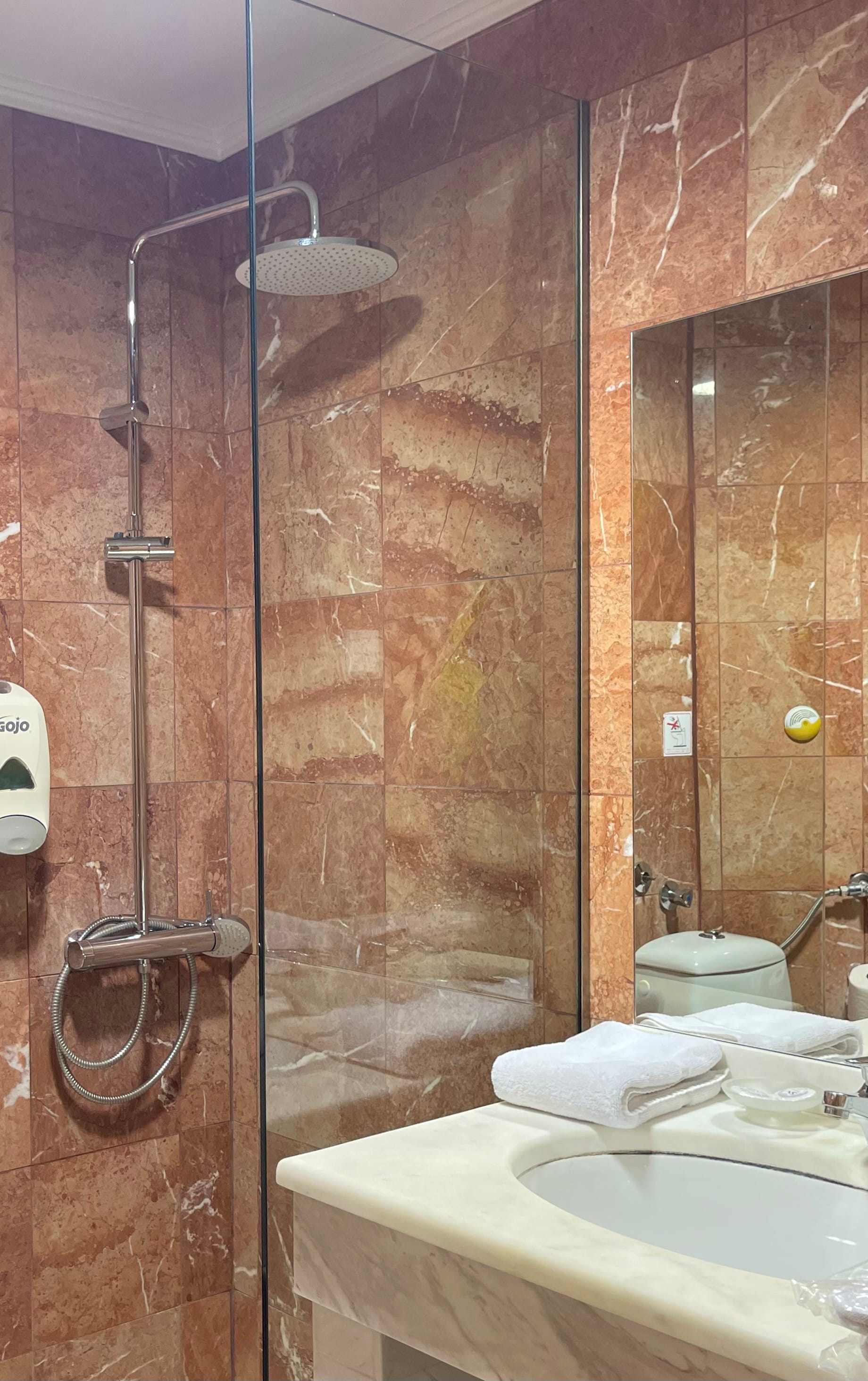 a bathroom with a shower and sink