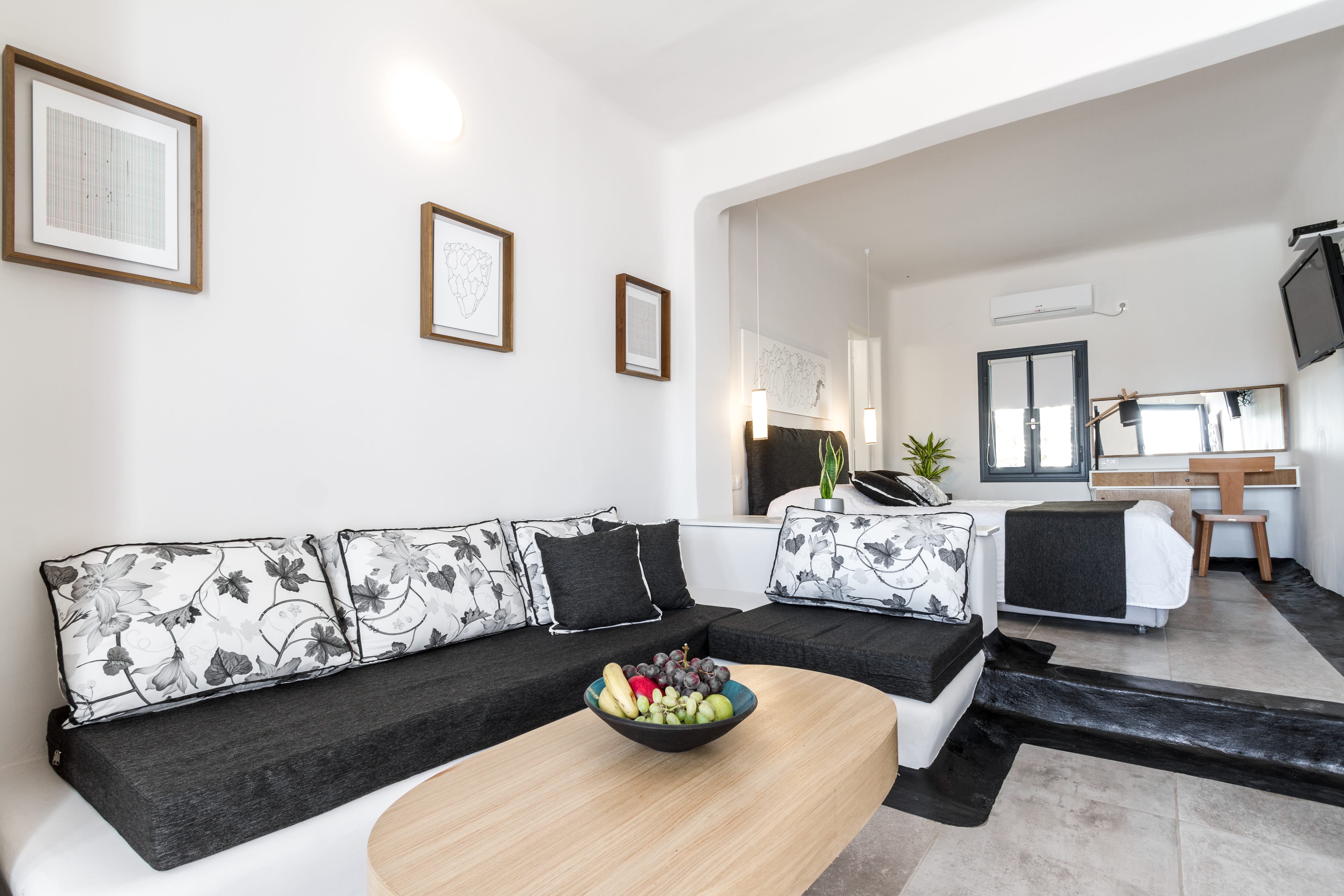 a living room with a black couch