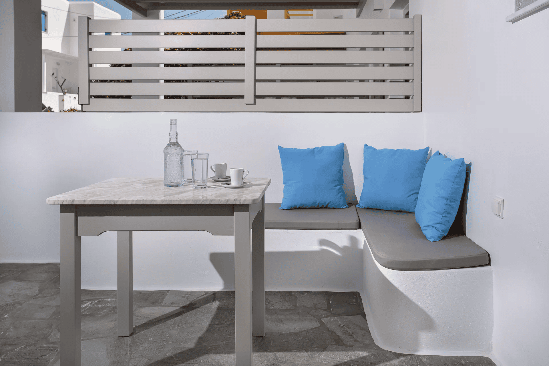 a white couch with blue pillows