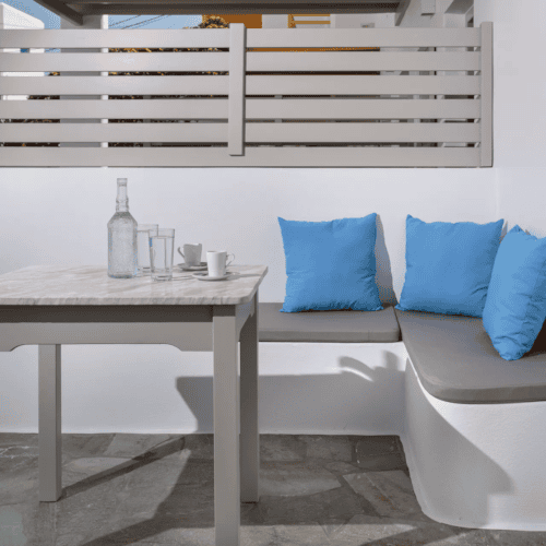 a white couch with blue pillows