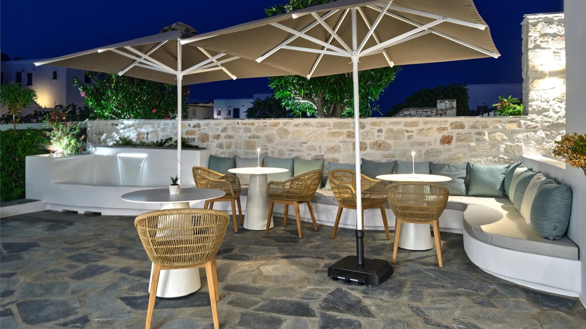 a patio with tables and chairs