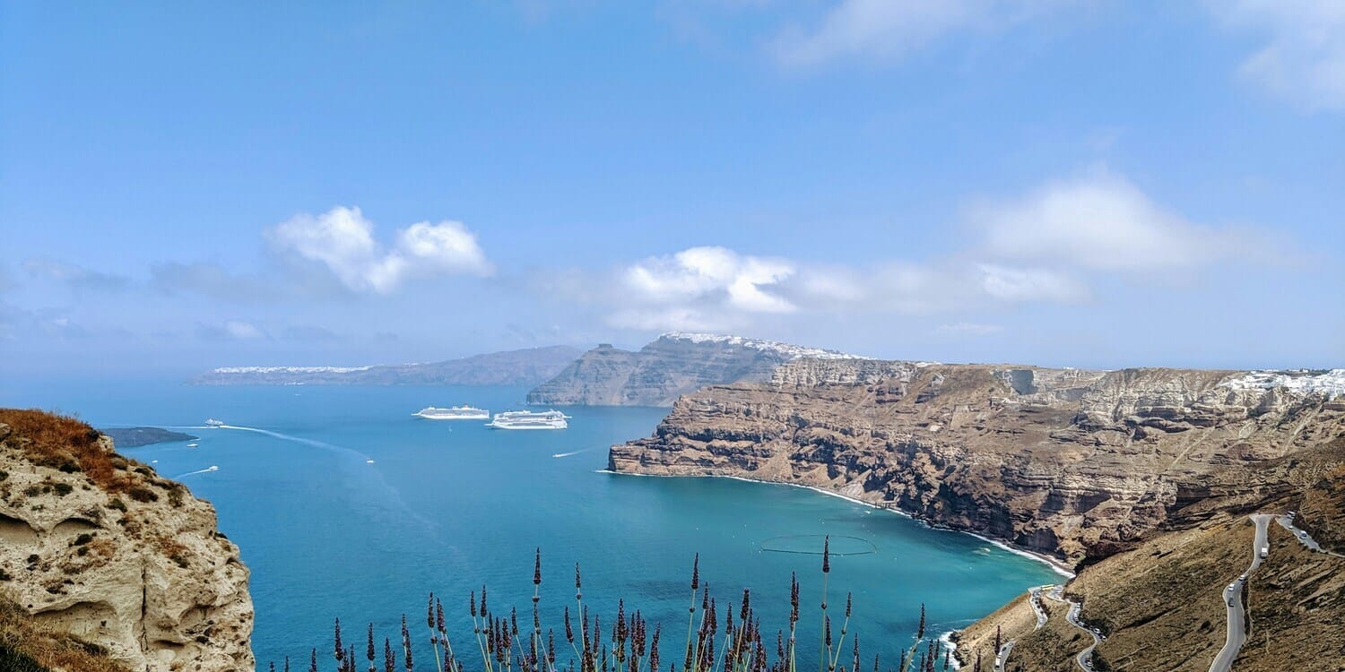 a body of water with mountains around it