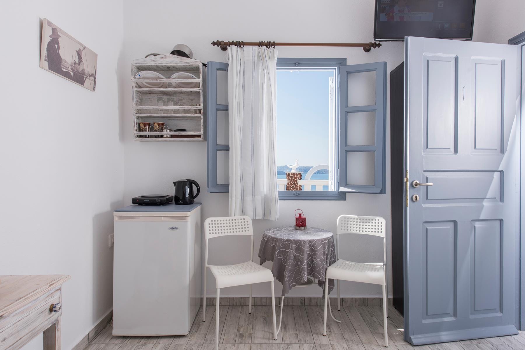 a kitchen with a table and chairs