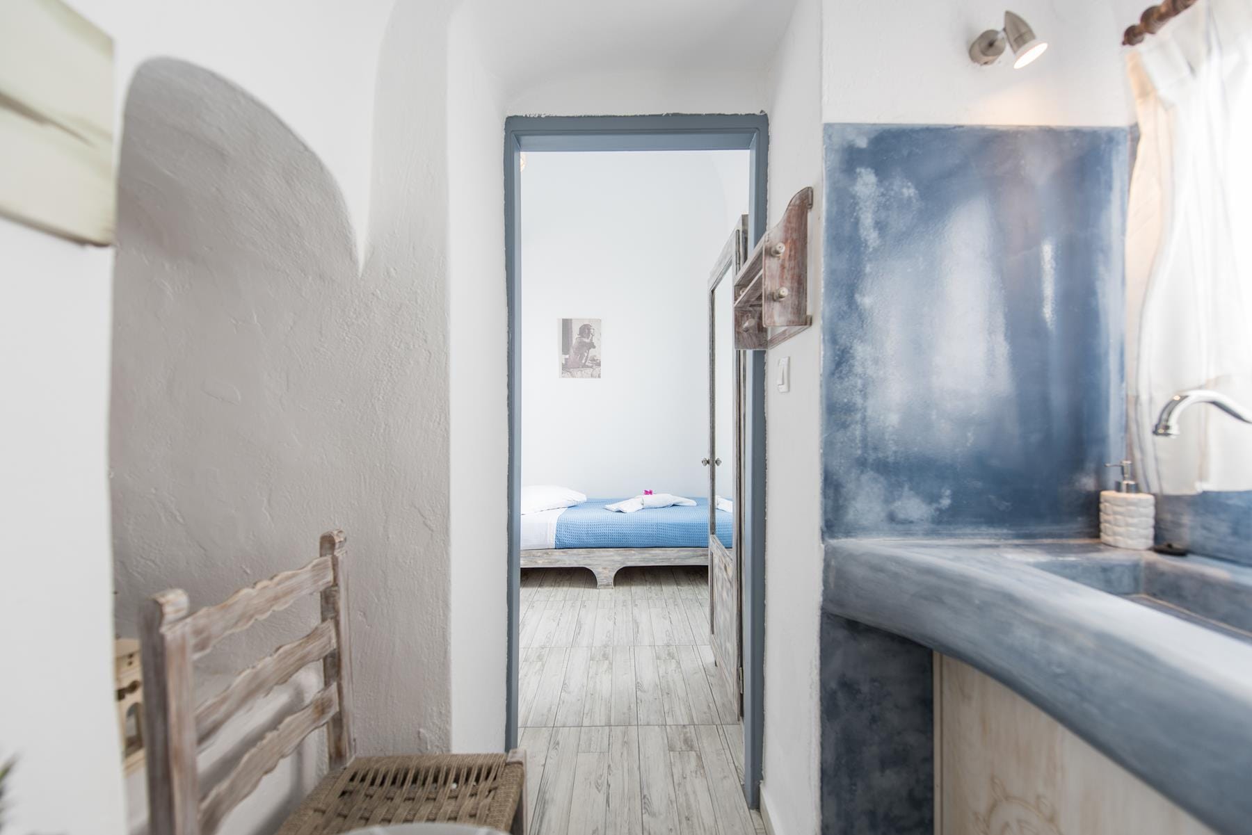 a bathroom with a bed and a shower