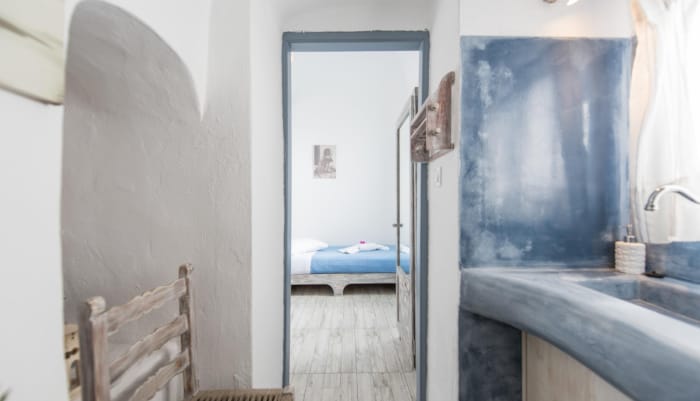 a bathroom with a bed and a shower