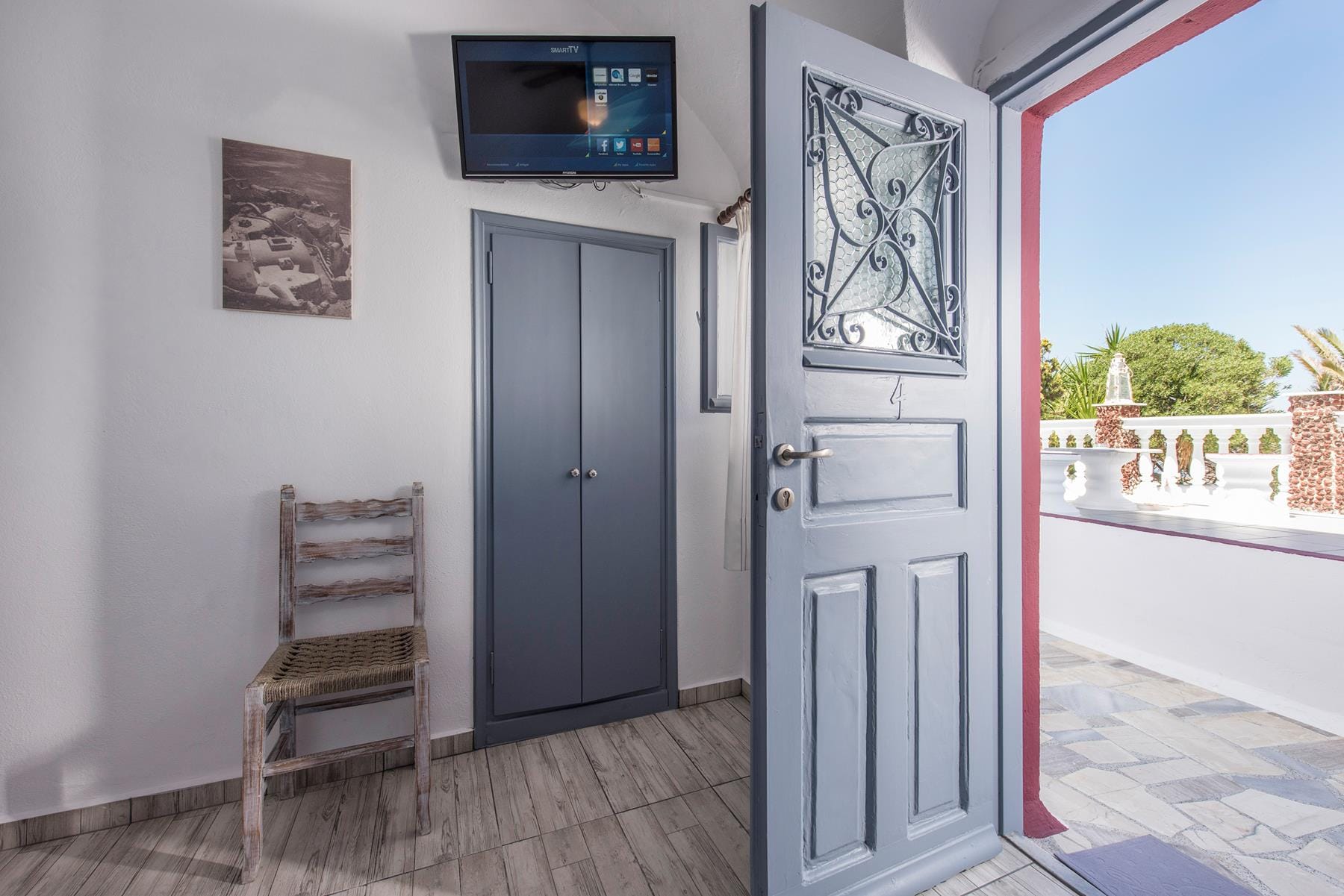 a room with a tv and a chair