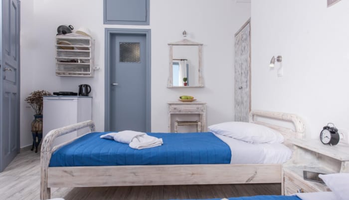 a room with a bed and a mirror