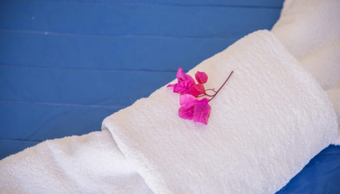 a pink heart on a white towel