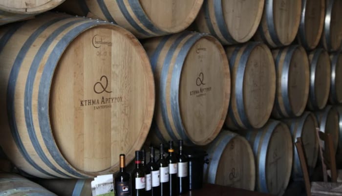 wine and a group of barrels