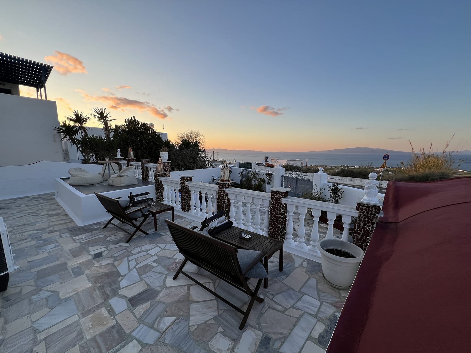 a patio with chairs and tables at maryloujohn villas