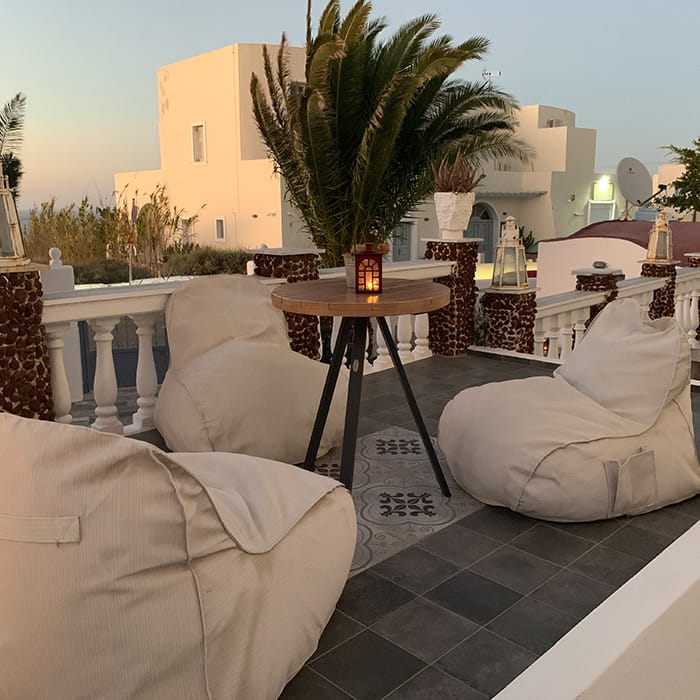 a patio with a table and chairs