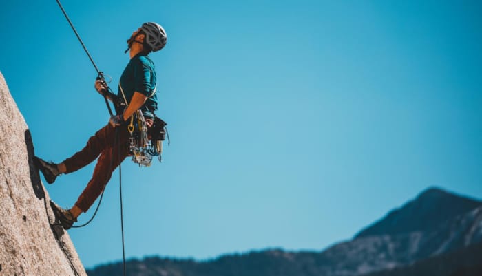 a man rock climbing