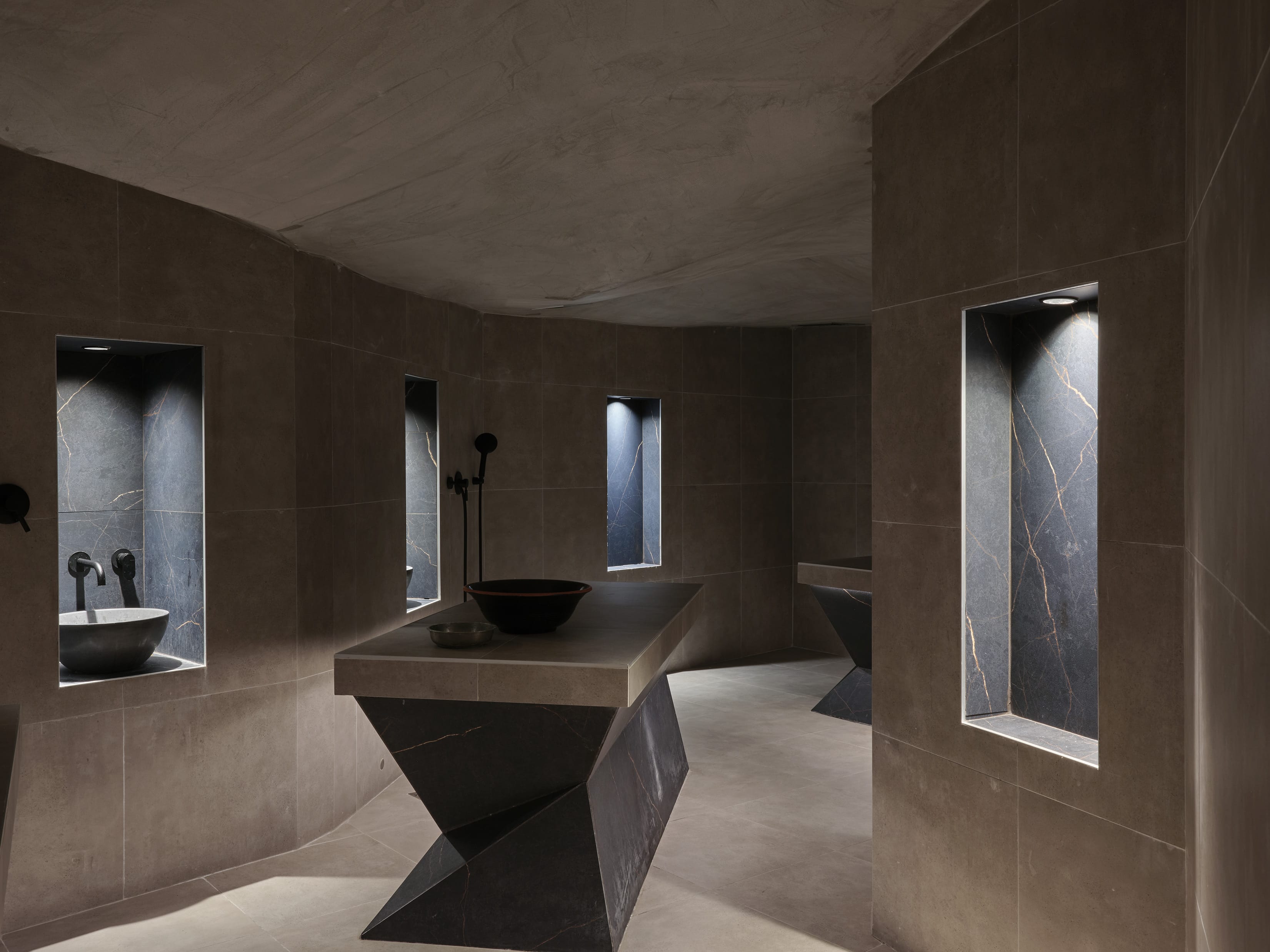 a bathroom with a large marble sink