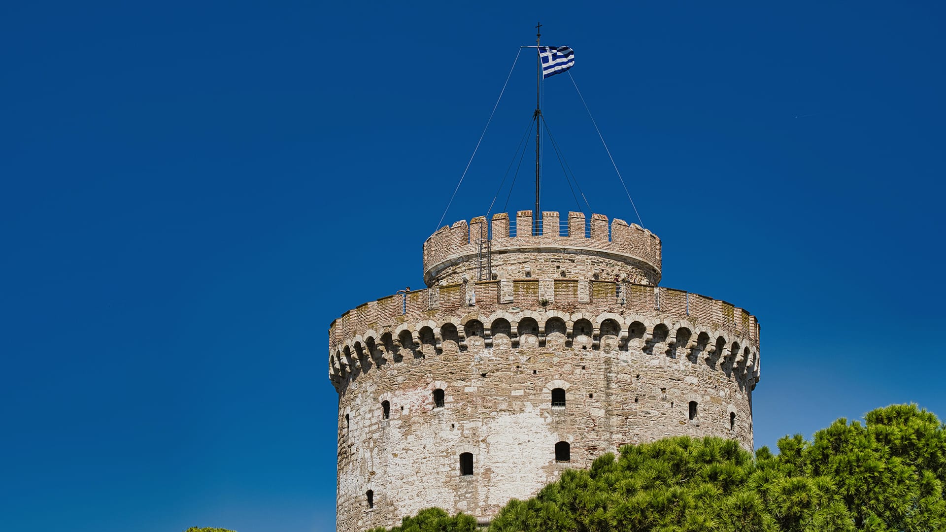 a stone castle with a flag on top