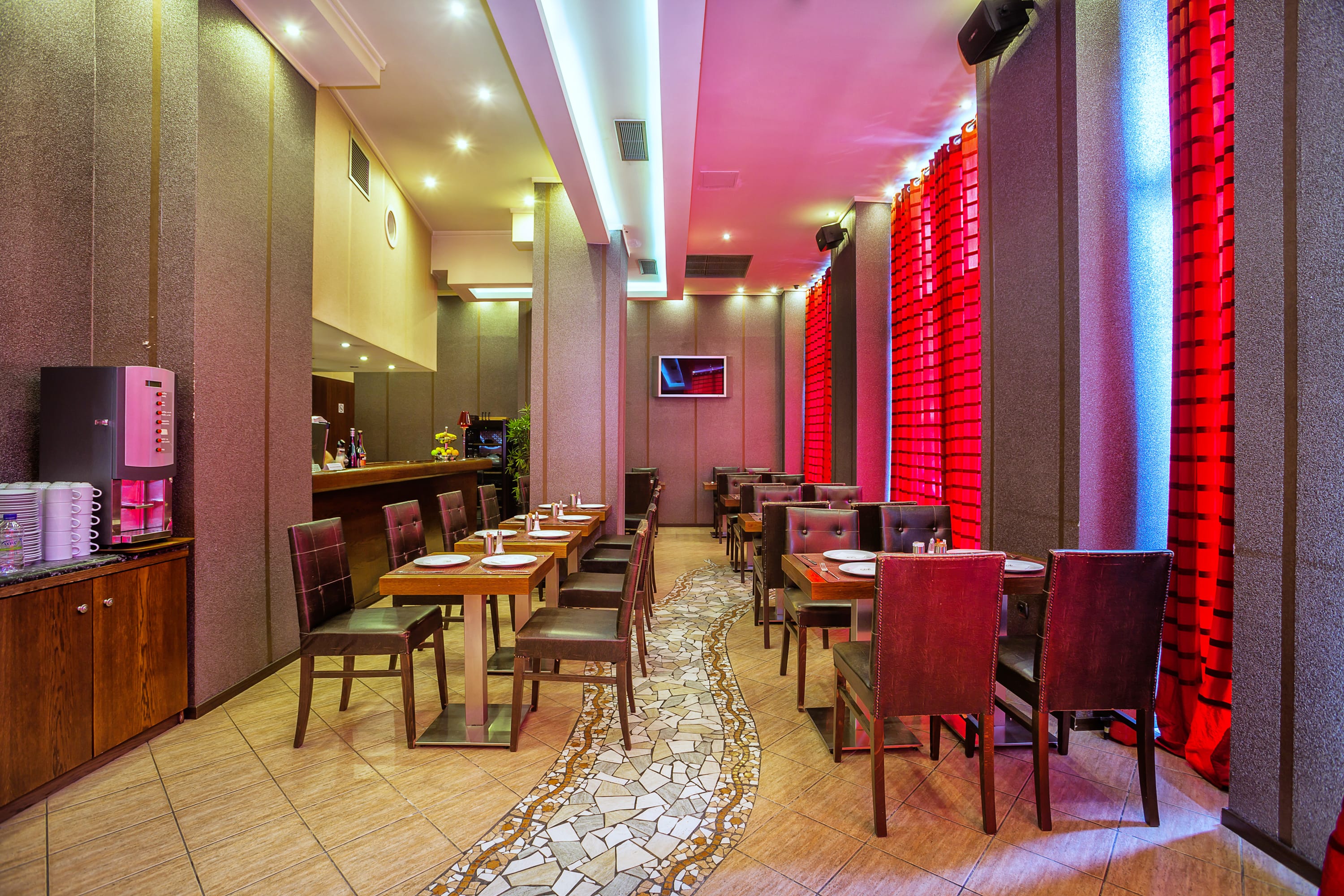 a restaurant with tables and chairs