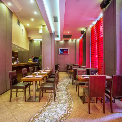 a restaurant with tables and chairs