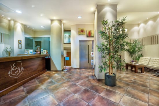 a lobby with a few plants